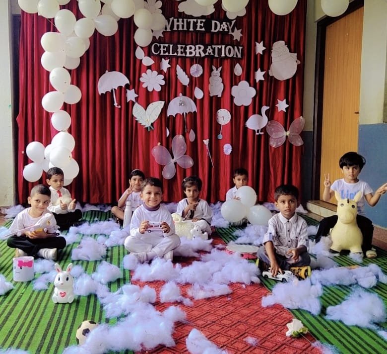 "Nature always wears the colours of the spirit. The colour white is associated with innocence, success, and purity."
KSR CBSE SCHOOL celebrated White Day for pre-primary 
Our tiny tots Kids saw various white-coloured objects and learned to recognize them. Even the corridor were decorated in-sync with the theme. Moreover, all children and teachers dressed in white, all of them looking like angels. The aura was immensely peaceful and calming throughout the day!